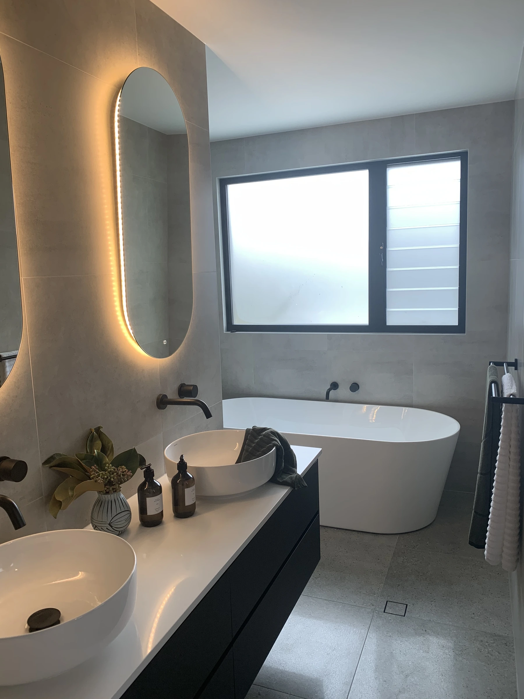 Freestanding bath and lit mirror bathroom renovation Gold Coast