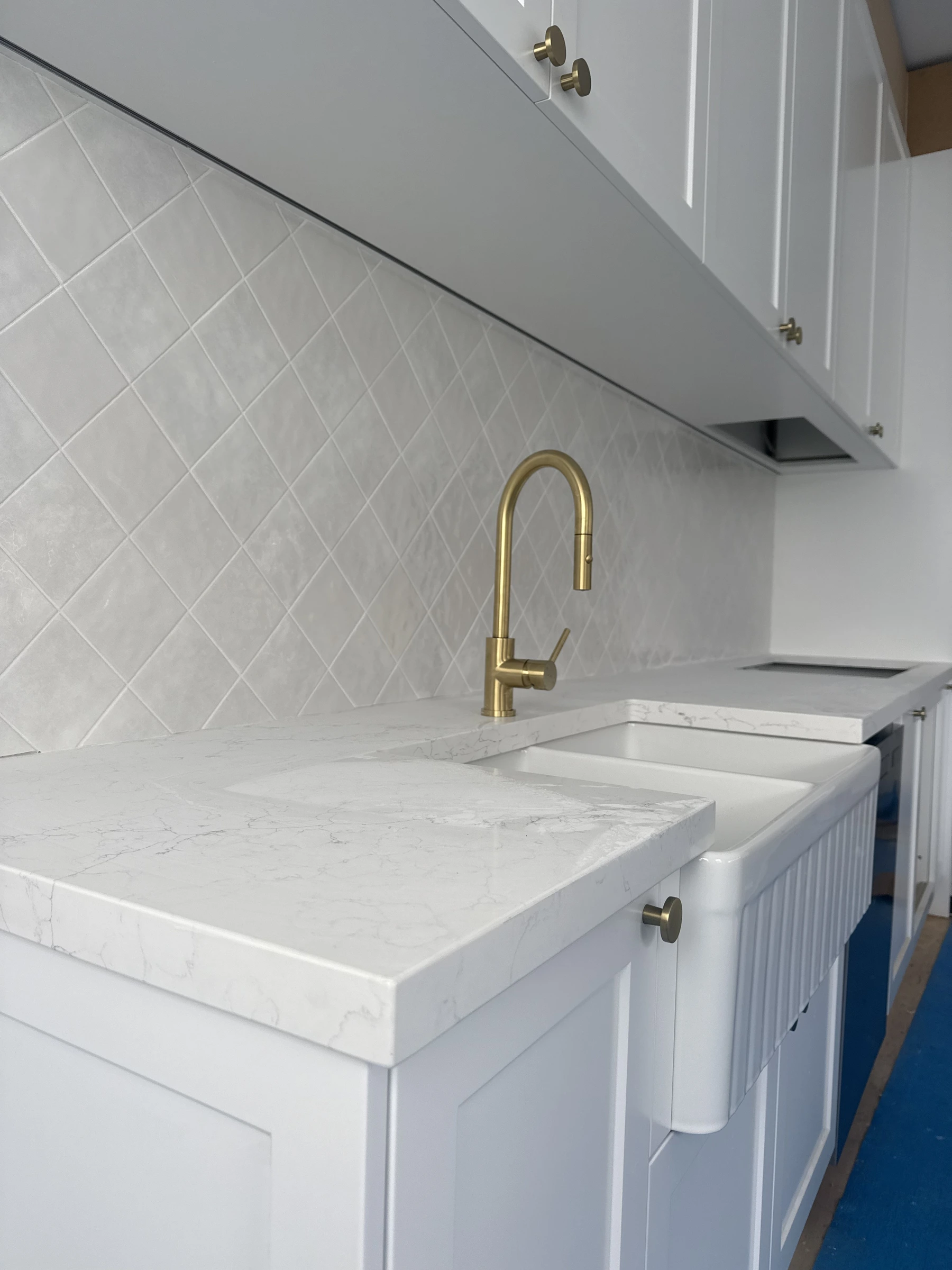 Kitchen sink and gold tapware fitoff Gold Coast