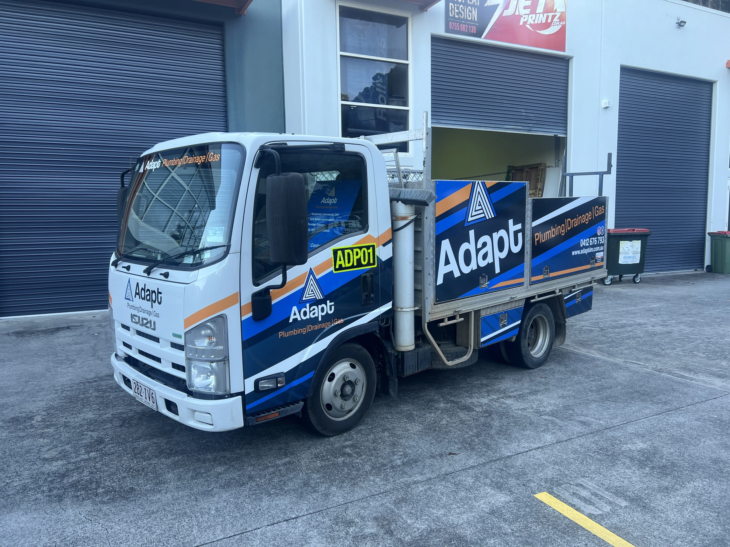 Adapt Plumbing branded Isuzu truck Gold Coast